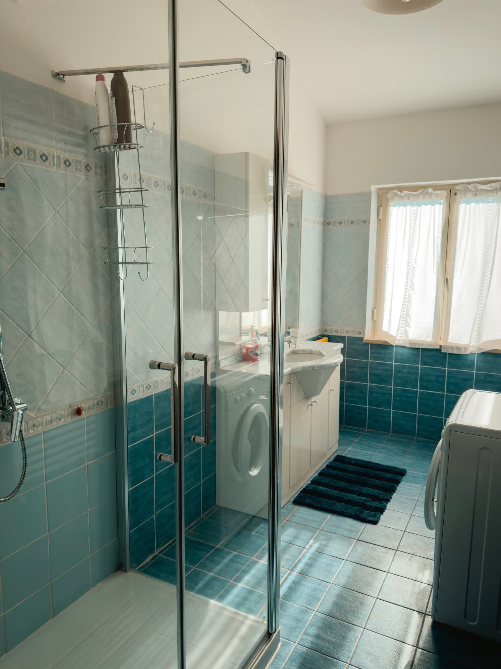 The glass shower cabin in the bathroom